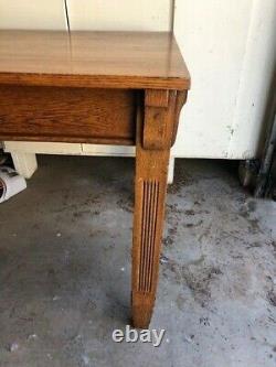 Oak mission style library table. Antique. Detail work on the legs. One drawer