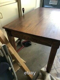 Oak mission style library table. Antique. Detail work on the legs. One drawer